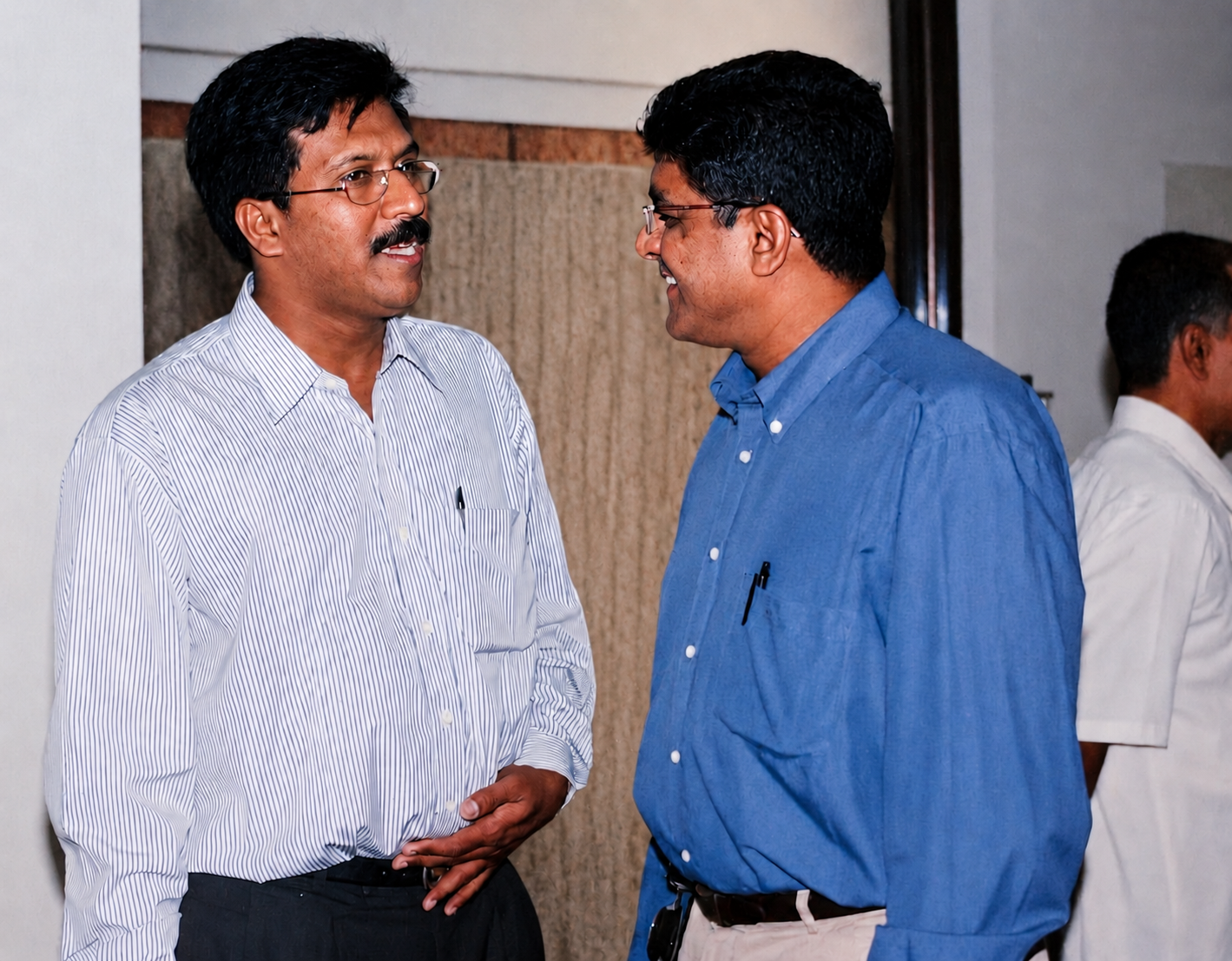 Our founder, Late Mr. T.M.S Kutty, in conversation with a colleague